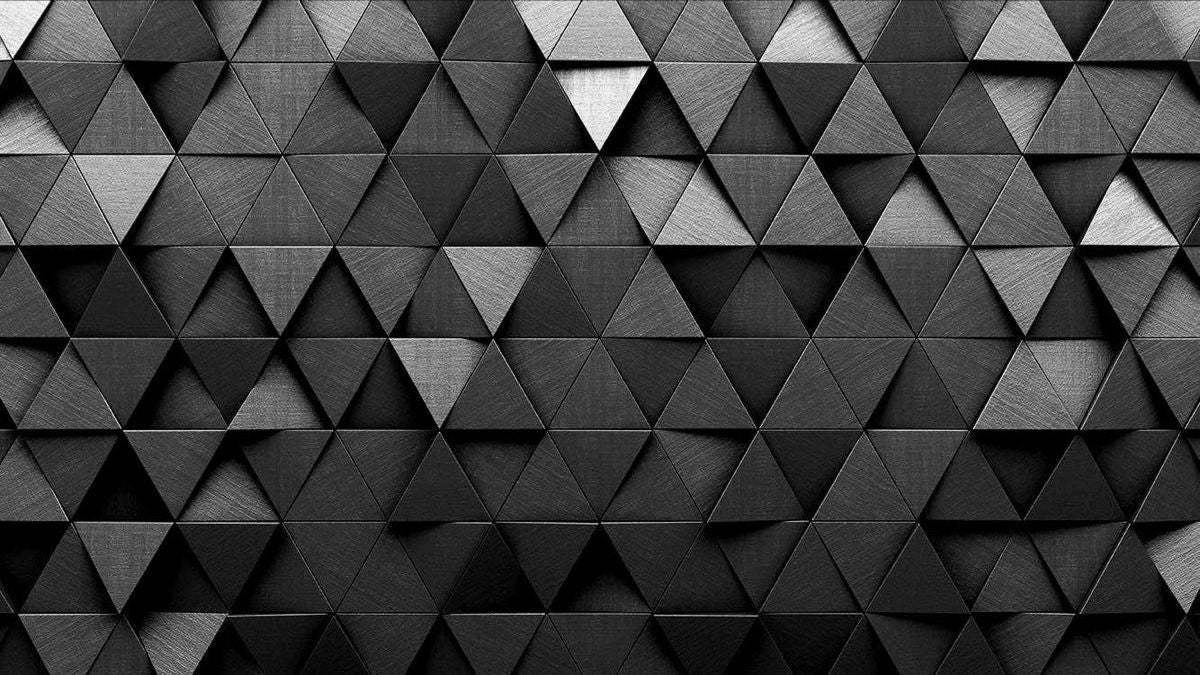 Cabecero de cama con patrón geométrico tridimensional en negro profundo, diseño contemporáneo y minimalista.